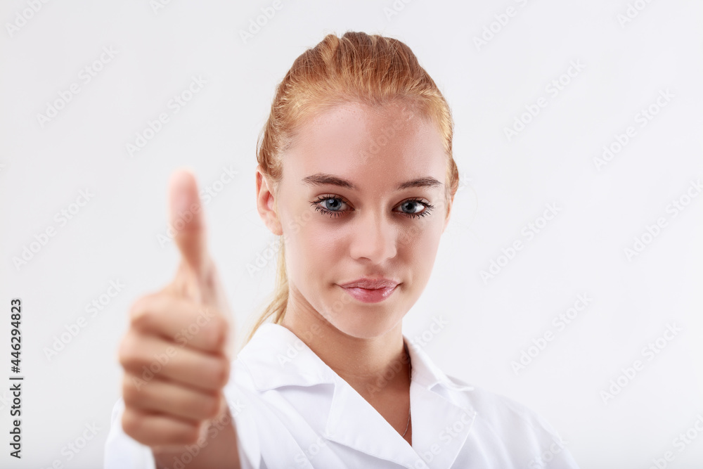 focus on the face, thumbs up blurred, woman focus on the face, thumbs up blurred, woman