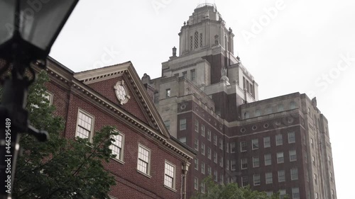 Large Old Building in Rainy Philadelphia from Behind Street Lamp 4K Low Angle