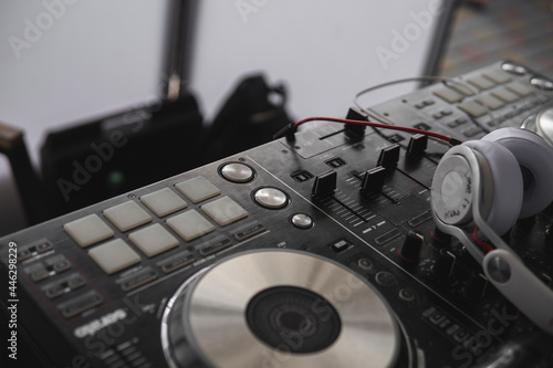 Audio Equipment for events. DJ control panel. Microphone and headphones. Sound, celebration and concert concept. Selective focus.
