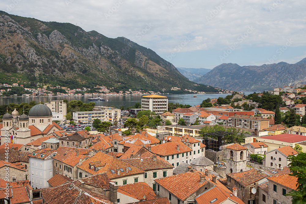 Beautiful top view of the old town of Kotor, Montenegro. Orange tiled roofs of houses from above.