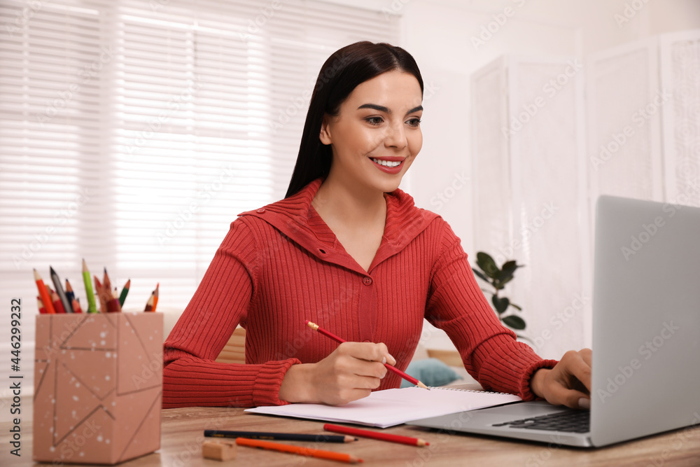 Happy woman drawing picture at online art lesson indoors. Distant learning Happy woman drawing picture at online art lesson indoors. Distant learning