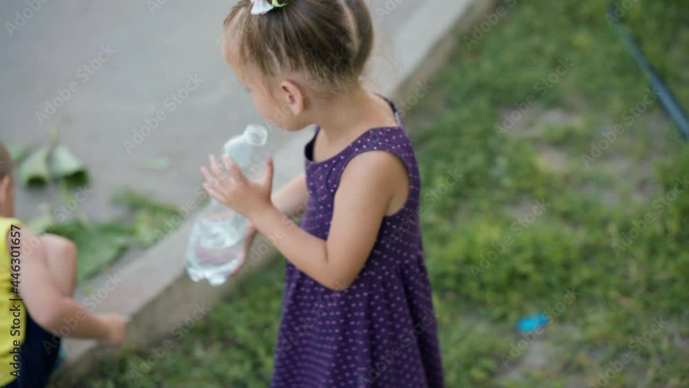 Little Girl Drinking Water Big Plastic Bottle Summer Day Park. Caucasian Female Child Drink Water Refreshing Outdoor Little Girl Drinking Water Big Plastic Bottle Summer Day Park. Caucasian Female Child Drink Water Refreshing Outdoor