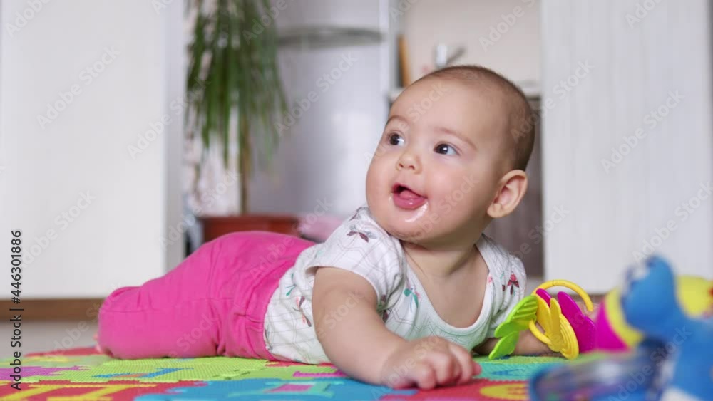 Portrait of a nice newborn baby , lying on his stomach looking interestingly at camera. Portrait of a nice newborn baby , lying on his stomach looking interestingly at camera.