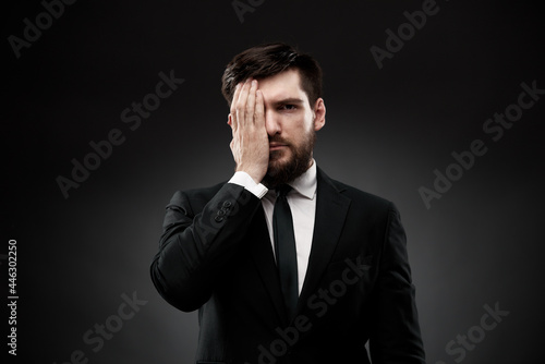 Man covering face with one hand showing emotional stress