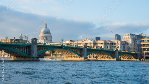 Fototapeta Naklejka Na Ścianę i Meble -  London cityscape with riverbank and green bridge. Saint Paul cathedral in the background. London, UK, Europe
