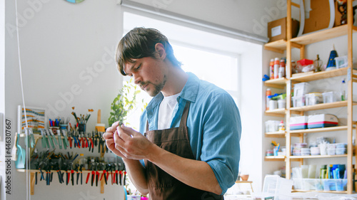 Young master in an apron at work