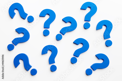 A multitude of blue question marks on a white background. Concept of indecision and doubt. 3d Render.