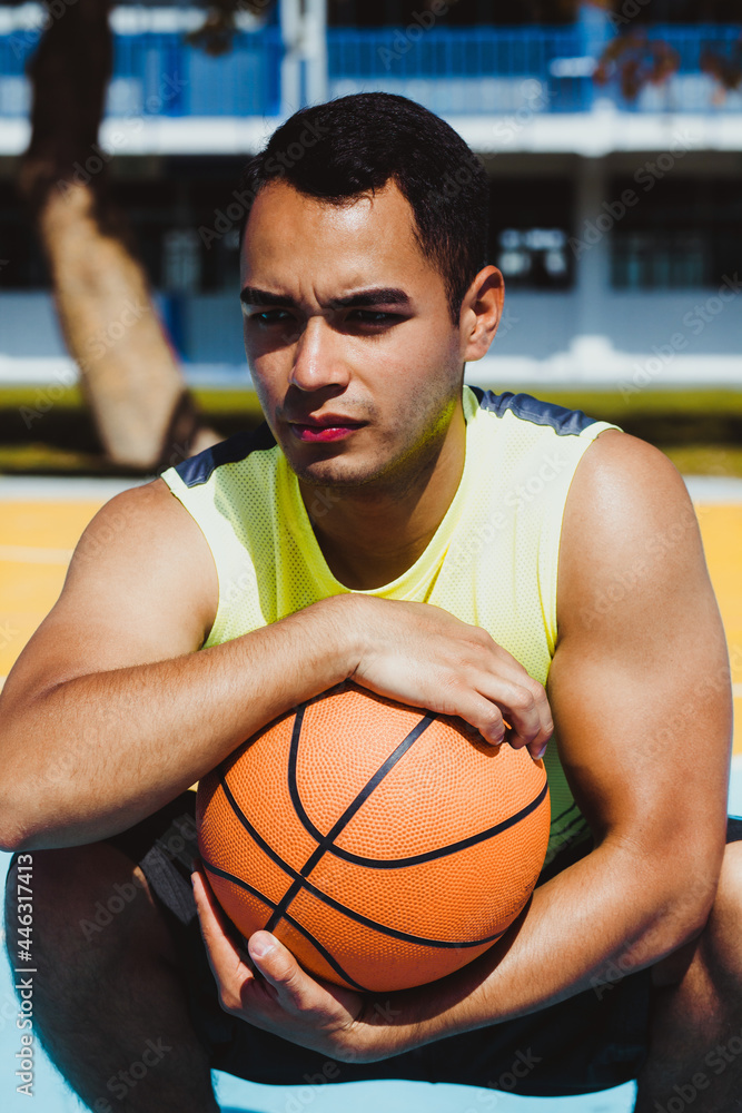 young latin man playing basketball portrait in Mexico young latin man playing basketball portrait in Mexico