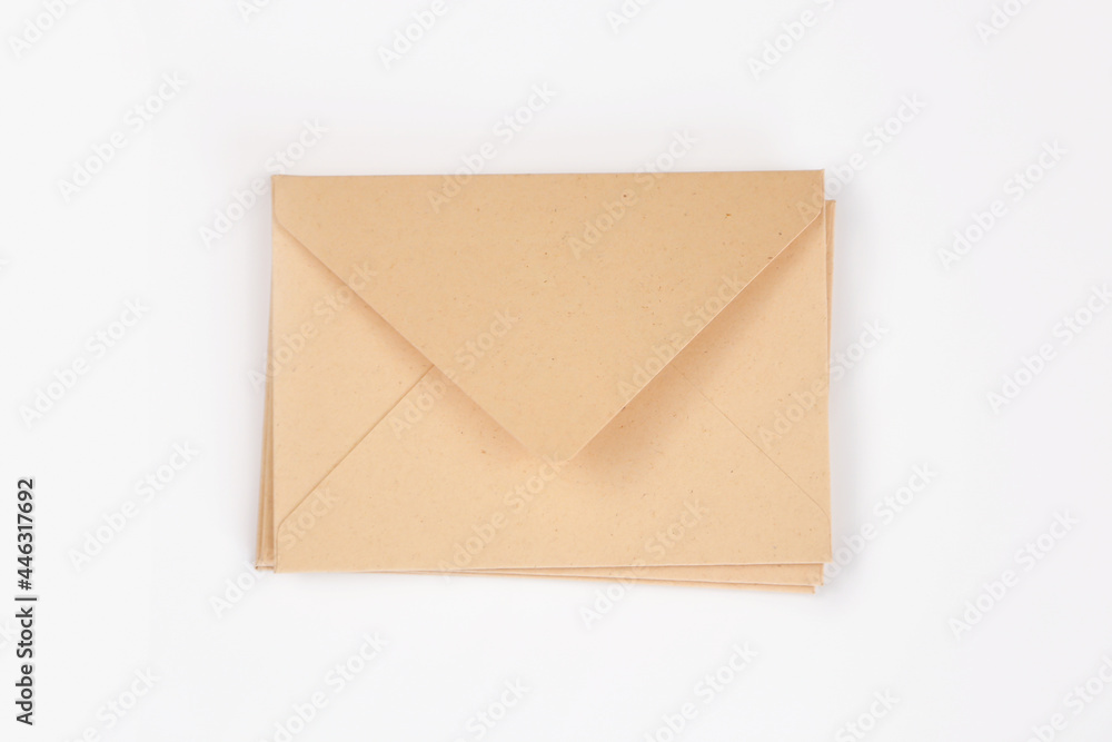 Stack of light brown paper open envelope on white isolated background. Three craft envelopes for invitations, certificates or cash gifts. Mockup, template, square envelope flap. Stack of light brown paper open envelope on white isolated background. Three craft envelopes for invitations, certificates or cash gifts. Mockup, template, square envelope flap.