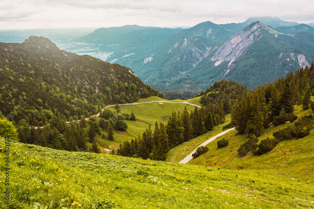 Panoramic mountain view. Alpine landscape, spruce forest, the path, meadows, in Bavaria, Germany. From the top. Adventure in Europe. Panoramic mountain view. Alpine landscape, spruce forest, the path, meadows, in Bavaria, Germany. From the top. Adventure in Europe.