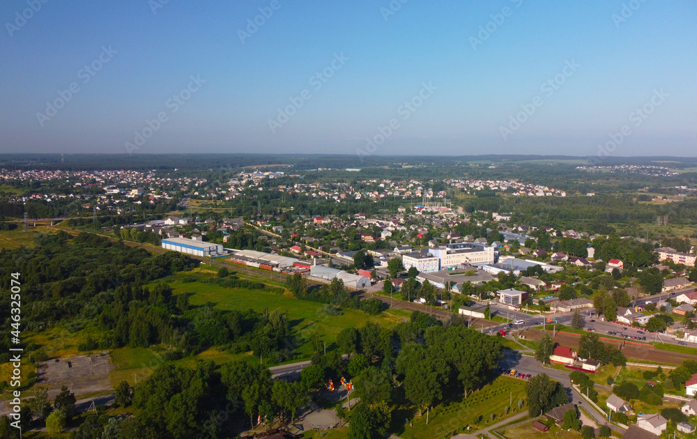 Aerial view of a small green city on a summer day