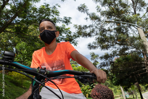 Latino hispanic teen on a mountain bike