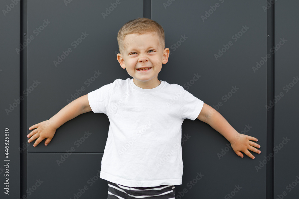 little boy in white t-shirt. space for your logo or design. Mockup for print little boy in white t-shirt. space for your logo or design. Mockup for print