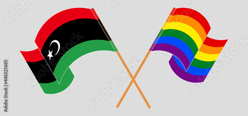 Crossed and waving flags of Libya and LGBTQ