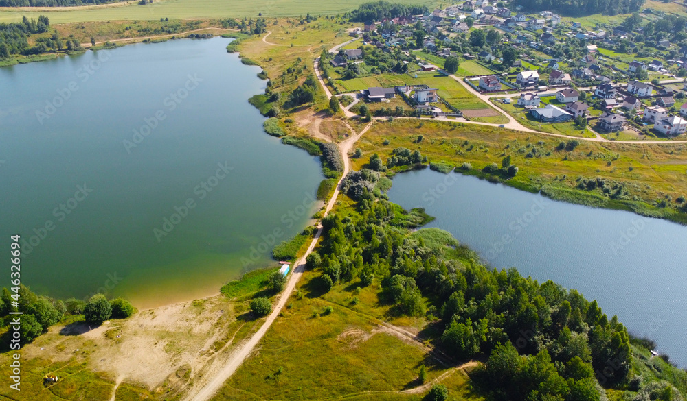 Aerial view of beautiful summer green island with river