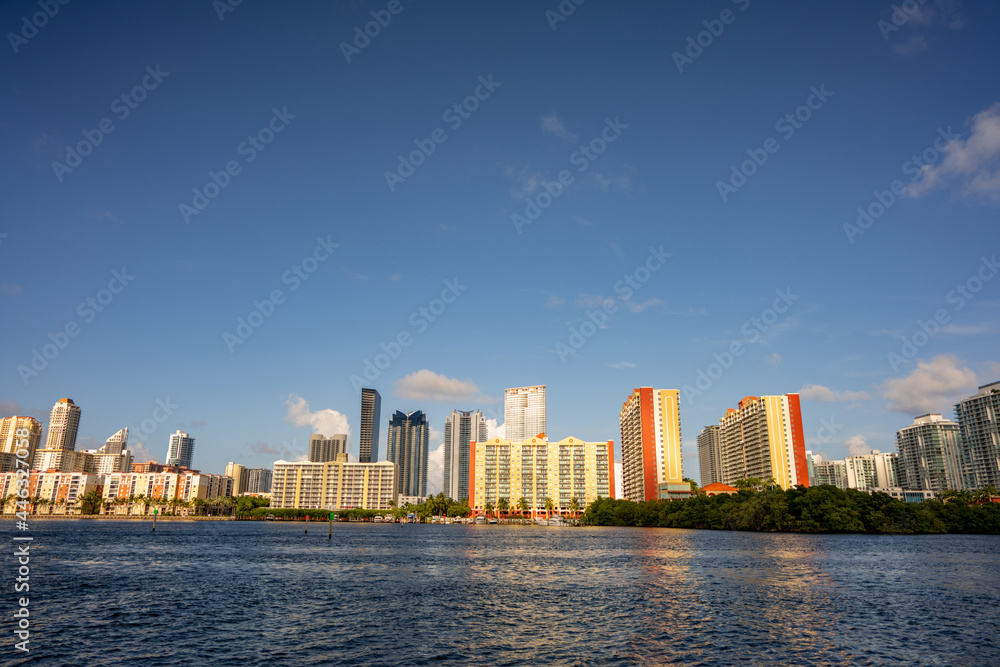Sunny Isles Beach with bay water in foreground
