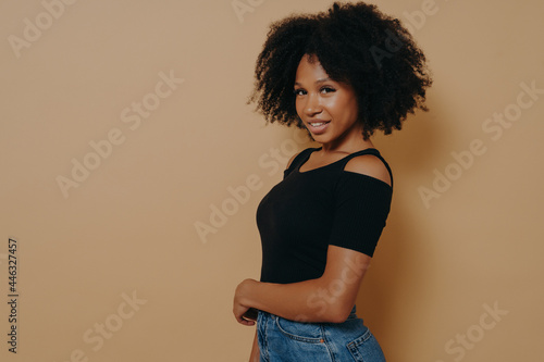 Profile portrait of cute gorgeous african american girl with beaming smile in casual outfit