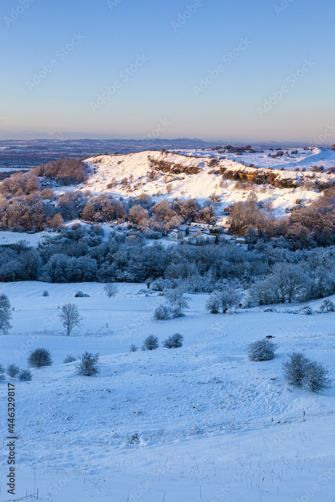 Early winter snow on Crickley Hill viewed from Barrow Wake. Crickley Hill was the site of Neolithic encampments and Bronze Age & Iron Age hill forts.