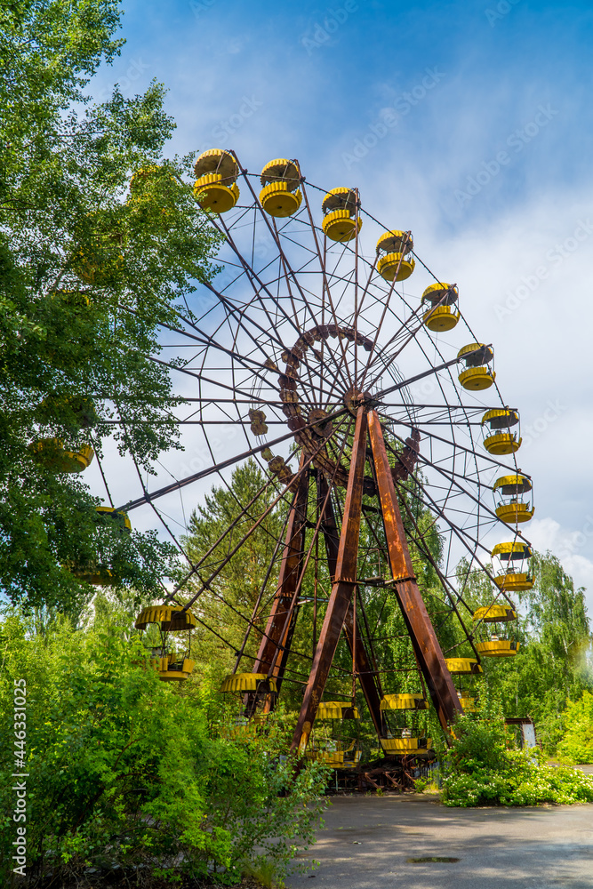 Vertical view of the abandoned ferris wheel in the decaying amusement park of Pripyat, Ukraine inside the Chernobyl Exclusion Zone
