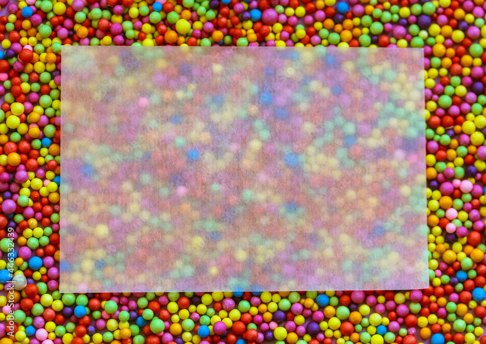 A beautiful blank white greeting mock up card with space for text on a colorful beads background. Rectangular frame. Matte translucent rectangular paper for writing congratulations. Jolly, fun concept A beautiful blank white greeting mock up card with space for text on a colorful beads background. Rectangular frame. Matte translucent rectangular paper for writing congratulations. Jolly, fun concept