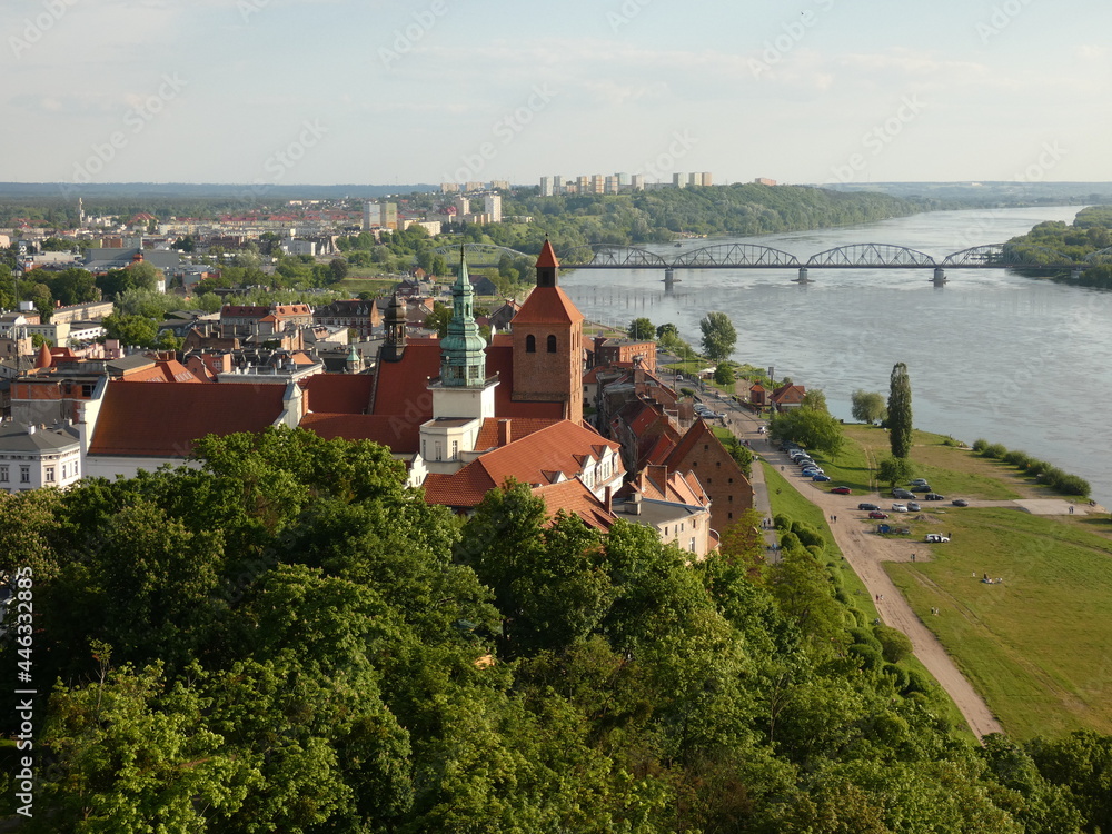 Obraz premium St. Nicolas' Church, City Townhall and Vistula river viewed from the top of Klimek lookout tower, Grudziądz, Poland