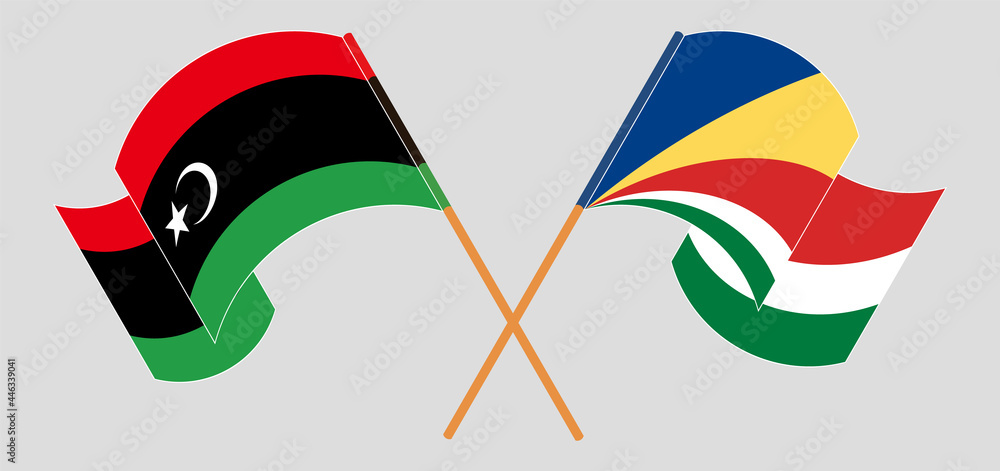 Crossed and waving flags of Libya and Seychelles Crossed and waving flags of Libya and Seychelles
