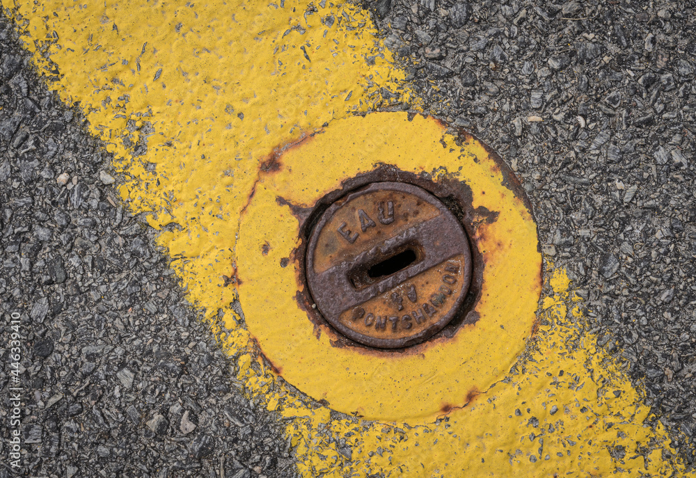 French water supply valve in a road.