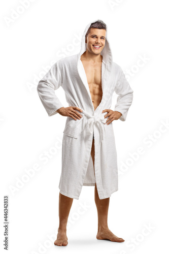 Quadro su tela Full length portrait of a young fit man wearing a white bathrobe