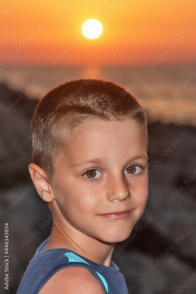 A nice boy on the beach at sunset A nice boy on the beach at sunset