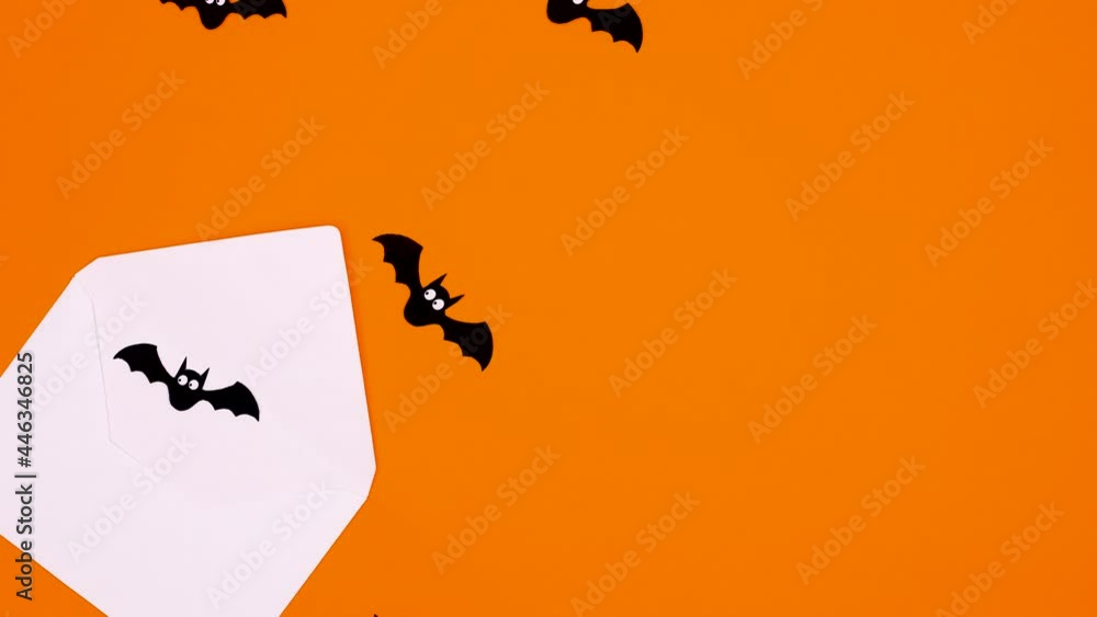 Halloween bats fly out from envelope on orange theme. Stop motion Halloween bats fly out from envelope on orange theme. Stop motion