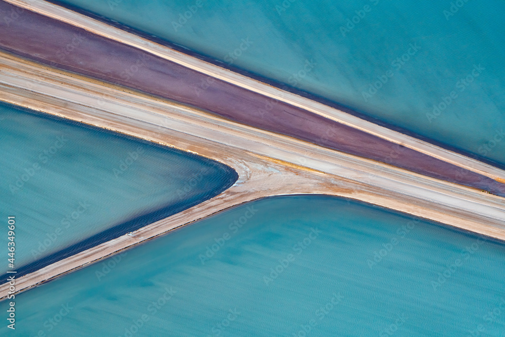 Obraz premium Aerial photography, Useless Loop, Shark Bay, Western Australia, June 2021, abstract images of salt ponds from above in varying colors of blue, green, and brown hues.