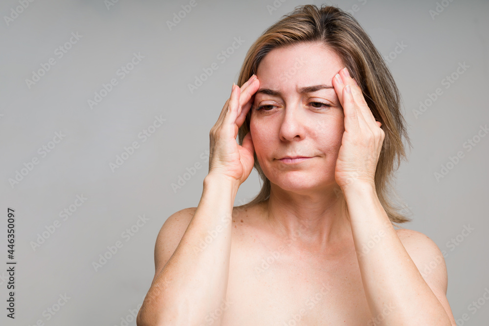 Upset older woman wants to prevent wrinkling Upset older woman wants to prevent wrinkling