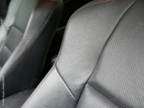 closeup of black leather car seat. 