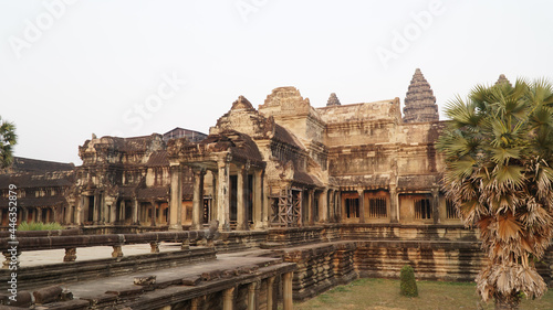 Ancient Khmer Empire temples in Angkor Wat during sunset.