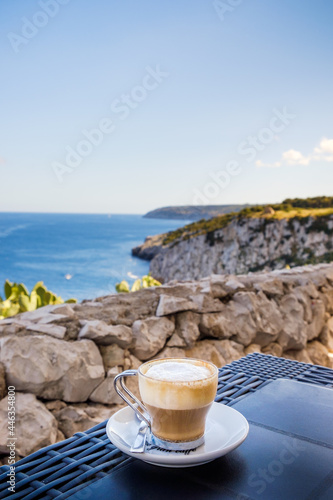 A cup of coffee with a view of the Salento coast line in southern Italy.