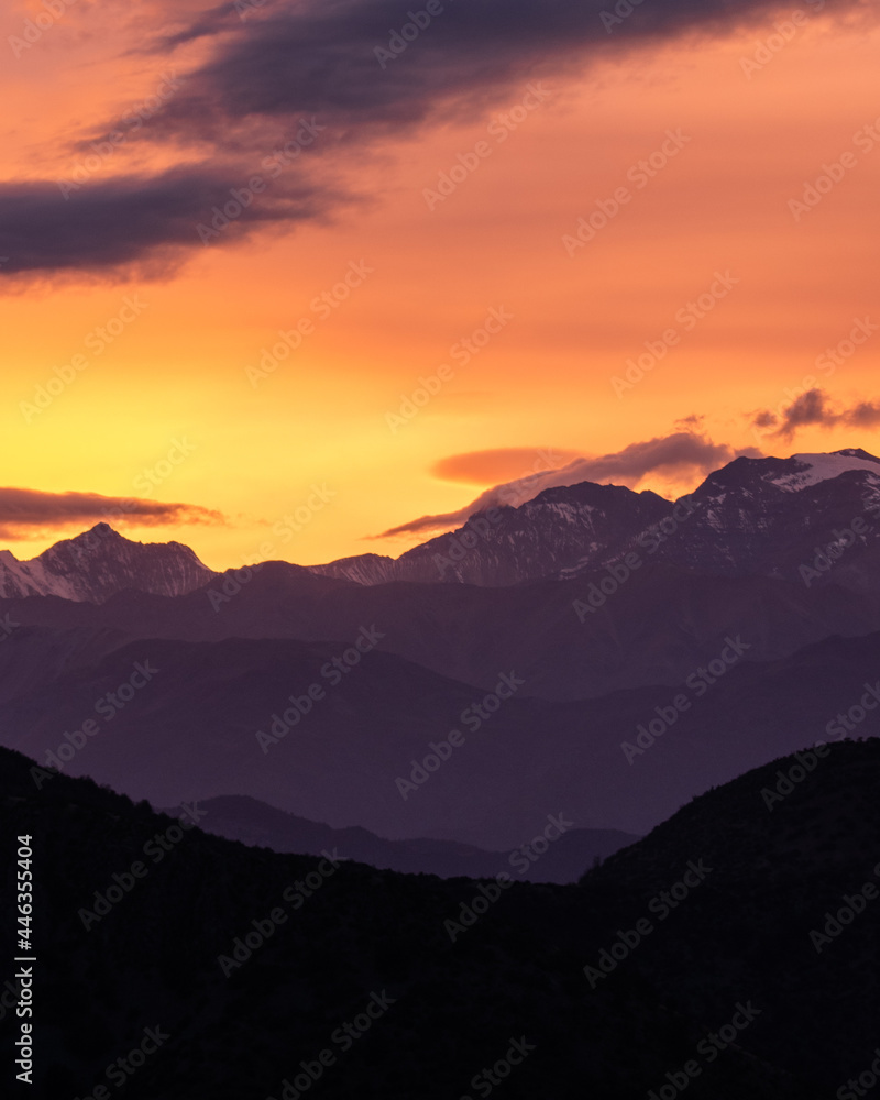 an incredible colorful sunrise from the mountains with snow