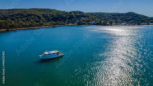 Morning escape - aerial waterscape with boats © Merrillie