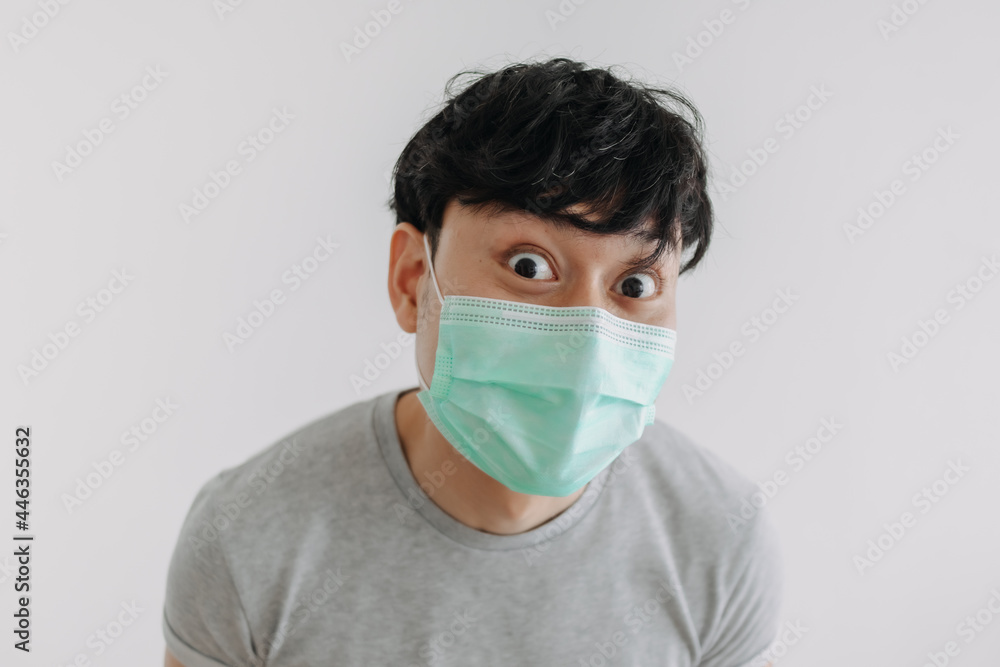 Close up of Happy Asian man wears mask isolated on white background. Close up of Happy Asian man wears mask isolated on white background.