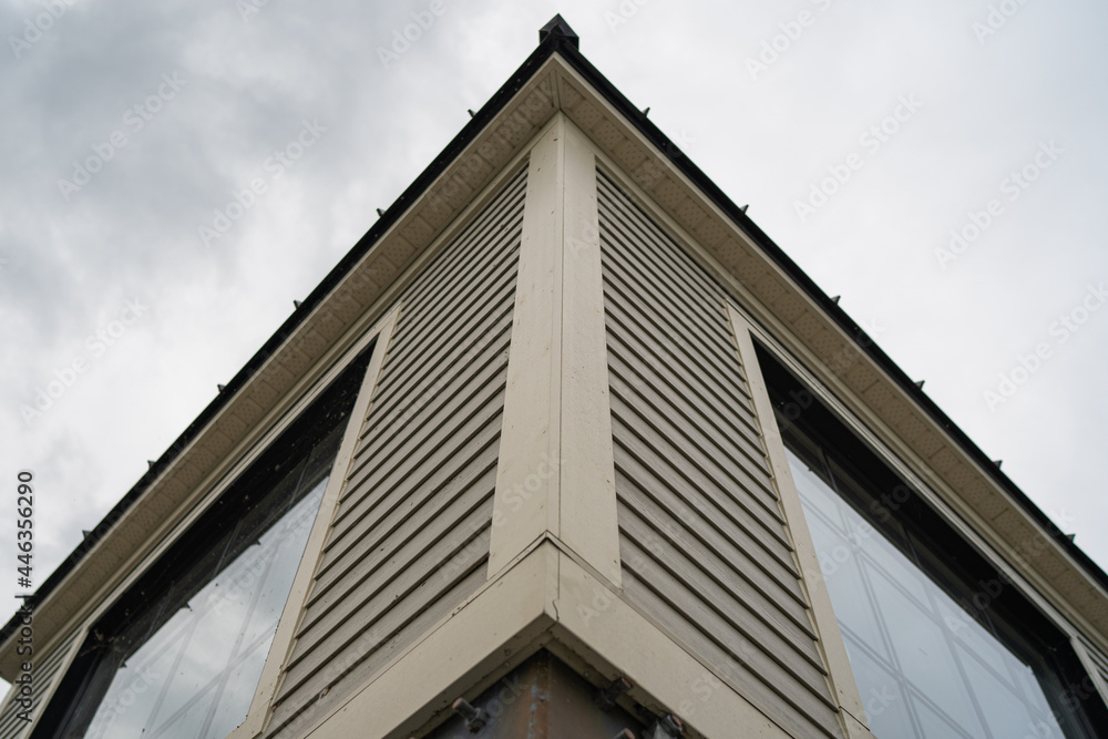 Corner building with windows in cloudy day