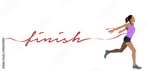 Winning female athlete crosses the finish line with finish letter.