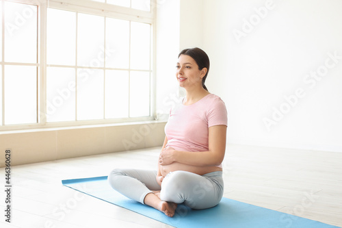 Young pregnant woman in gym