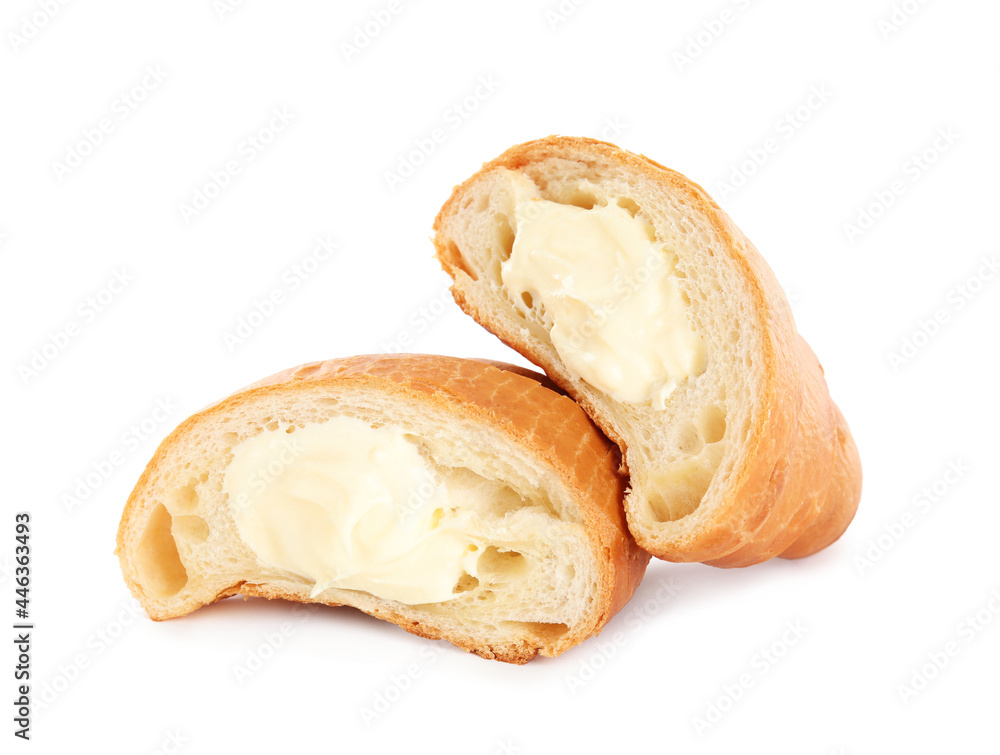 Halves of delicious croissant with cream on white background Halves of delicious croissant with cream on white background