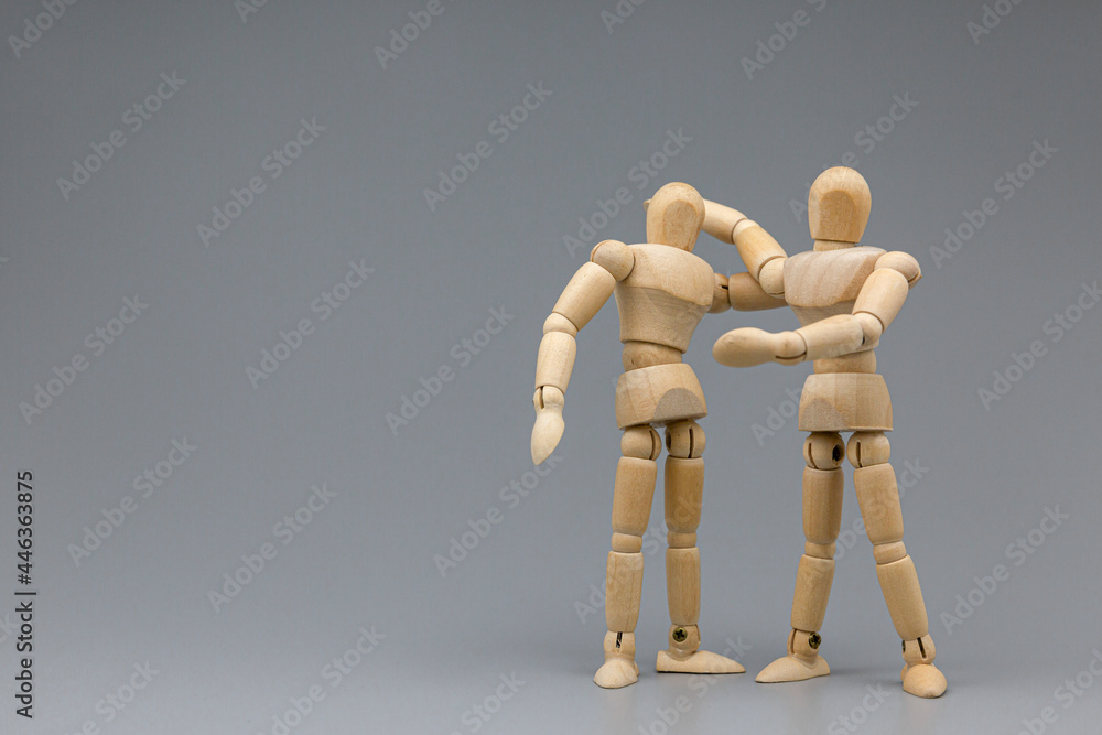 Wooden figure businessman pleasure and congratulate with team. Wooden figure businessman pleasure and congratulate with team.