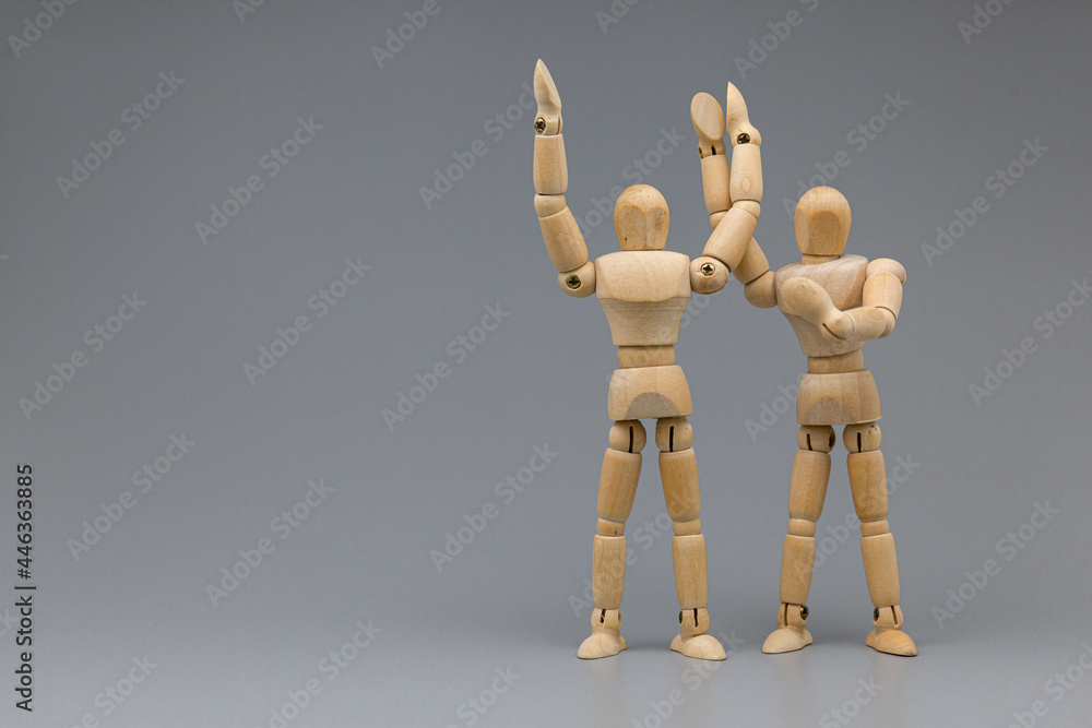 Wooden figure businessman pleasure and congratulate with team. Wooden figure businessman pleasure and congratulate with team.