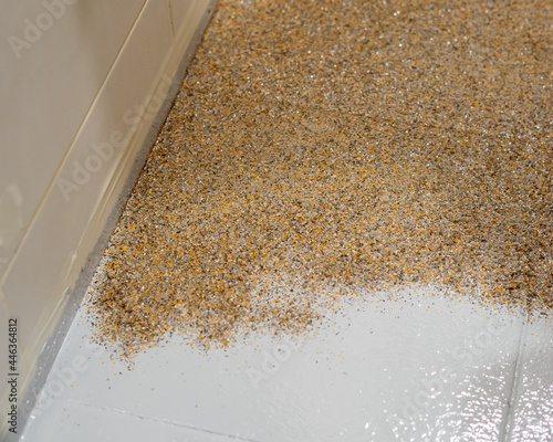 Color flake flooring textured background .Close up.Color Flakes make resinous flooring as beautiful as it is practical.Concrete floor,sprinkle with flake stone and smooth.