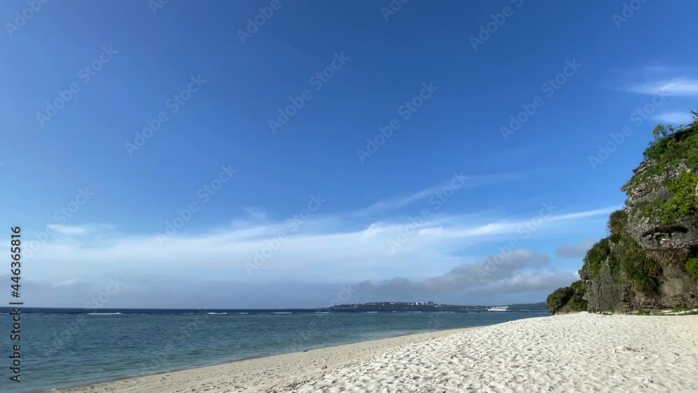 OKINAWA, JAPAN - JUNE 2021 : View of Sesoko beach (Ocean or sea) at Sesoko island. Clear blue summer sky and clouds. Wide view time lapse shot in daytime. Holiday, vacation and resort concept. OKINAWA, JAPAN - JUNE 2021 : View of Sesoko beach (Ocean or sea) at Sesoko island. Clear blue summer sky and clouds. Wide view time lapse shot in daytime. Holiday, vacation and resort concept.