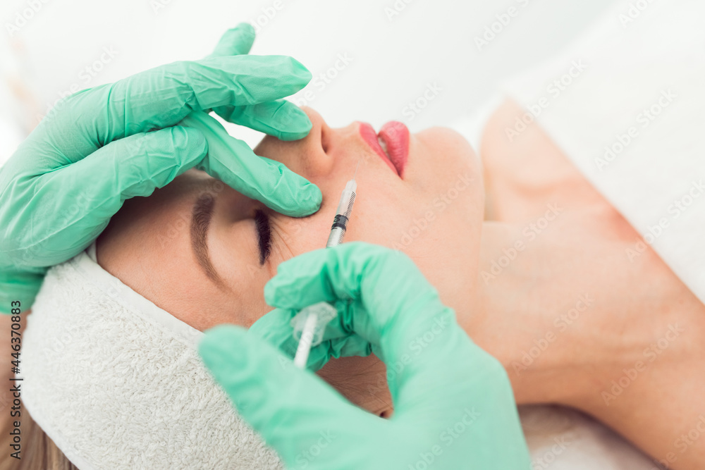 Beautiful woman gets botox injection in her face Beautiful woman gets botox injection in her face