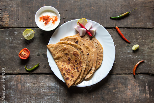 Obraz na płótnie Stuffed sattu ka paratha or channa dal paratha served with condiments and curd. An Indian breakfast dish. w salonie
