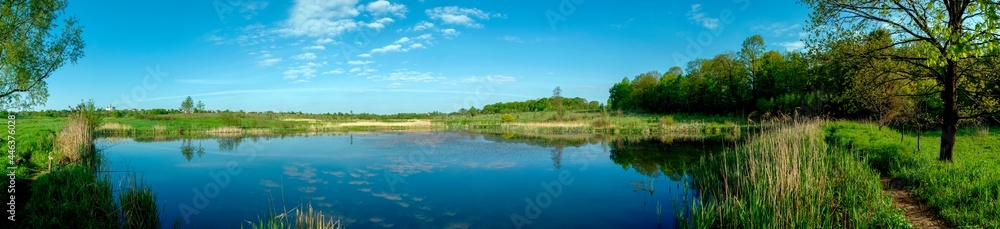 colorful panorama of autumn lake on a bright sunny day