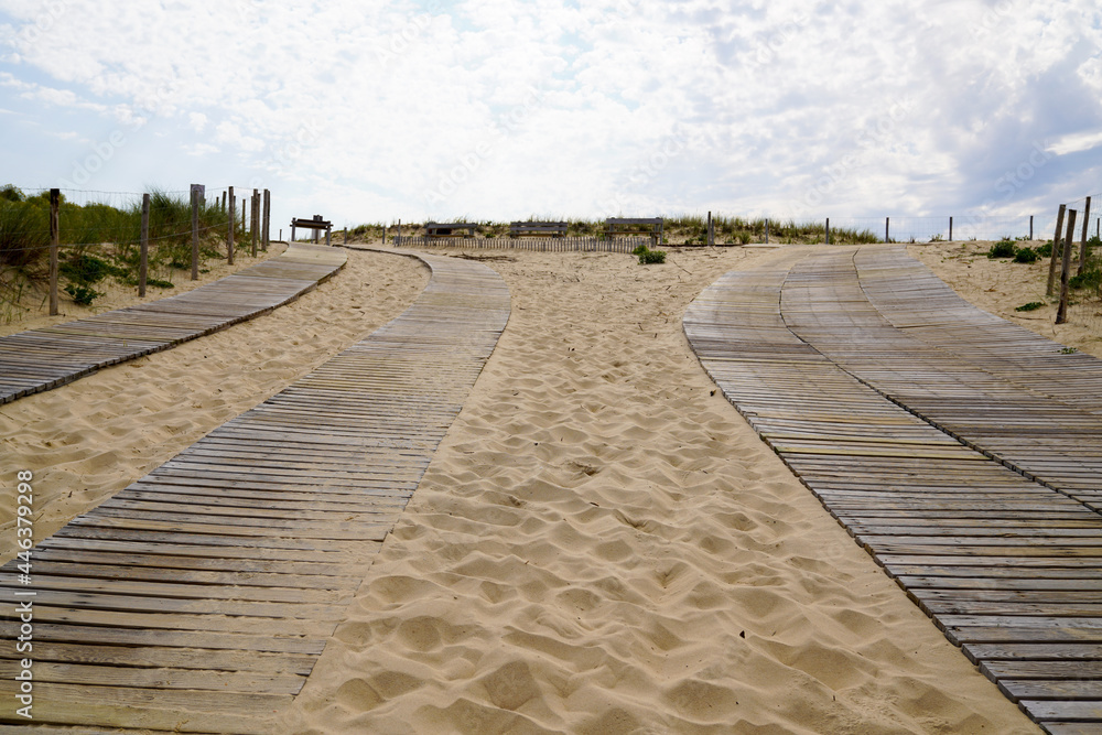wooden path leading from each side to access the beach to Cap-Ferret sea atlantic ocean in gironde france
